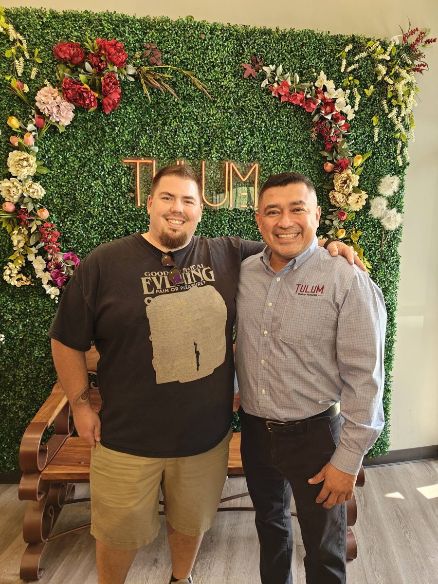 Chad with a local restaurant owner he has worked with